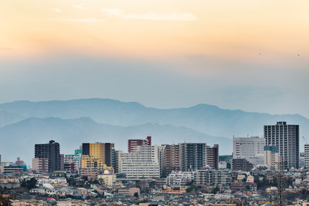 The residential area and the mountain in the evening seen from the suburbs of Yokohamaの写真素材