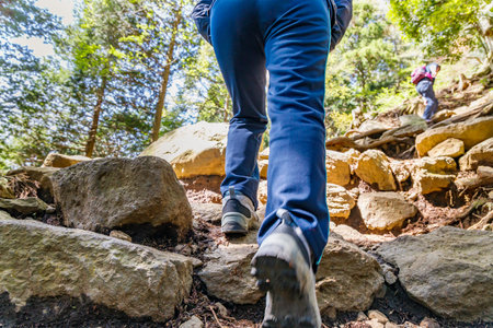 a person who walks on a mountain trail