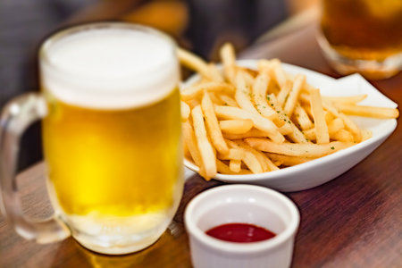 Classic beer and french fries at a drinking partyの写真素材