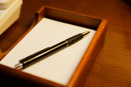 Telephone and writing utensils provided in the room at the resort hotelの写真素材