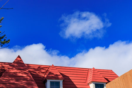 Beautiful blue sky and red roofの写真素材