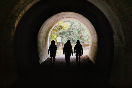 Women hiking in a tunnelの写真素材