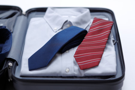 Business trip preparation of businessmen. Carry case and shirtの写真素材