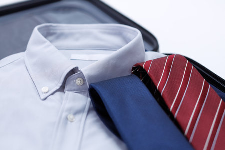 Business trip preparation of businessmen. Carry case and shirtの写真素材