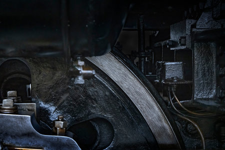 A sturdy-looking steam locomotive made of black metal partsの写真素材