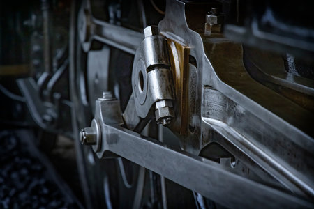 A sturdy-looking steam locomotive made of black metal parts