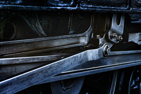 A sturdy-looking steam locomotive made of black metal parts