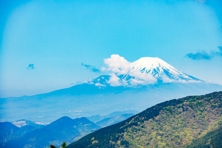 Mount Fuji and white clouds blowing in the windの写真素材