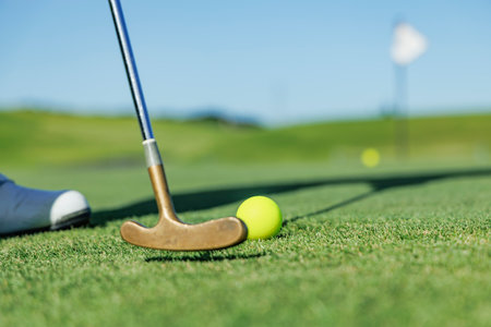 Beautiful green golf course and ball