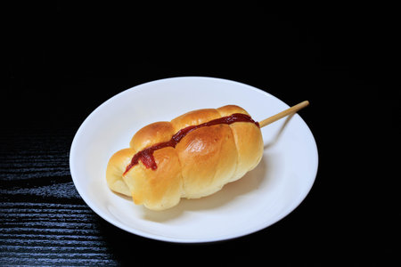bread with sausage wrapped in doughの写真素材