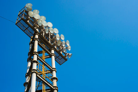 metal stadium lights for sport game with beautiful blue skyの写真素材