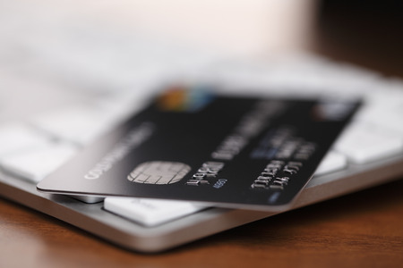 Concept of online shopping with keyboard and credit cardの写真素材