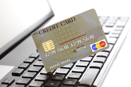 Credit card on laptop keyboardの写真素材