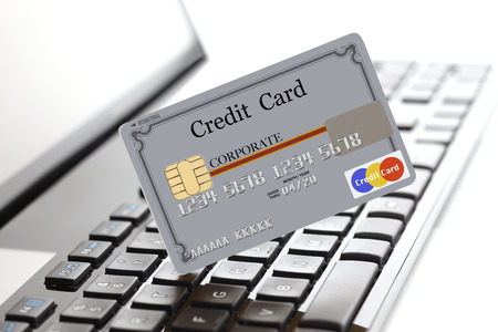 Credit card on laptop keyboardの写真素材