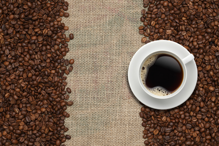 Coffee beans and Coffee cup on a jute backgroundの写真素材