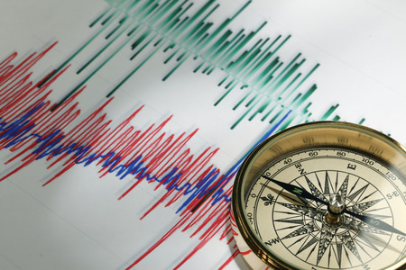 Close-up of a compass on stock market data chartの写真素材