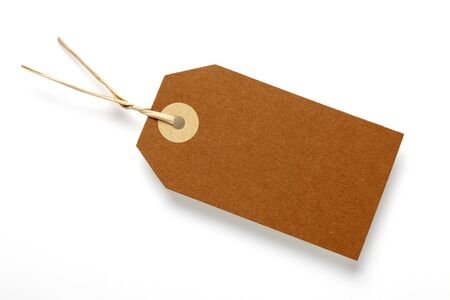 Blank price tag on white surface with soft shadowの写真素材