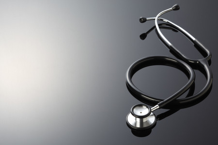 Stethoscope isolated on black  backgroundの写真素材