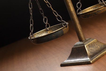 Justice Scale on wood tableの写真素材