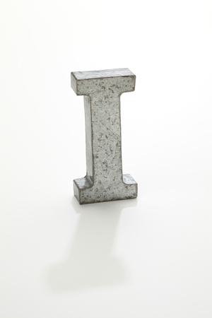 iron letter I isolated on whiteの写真素材