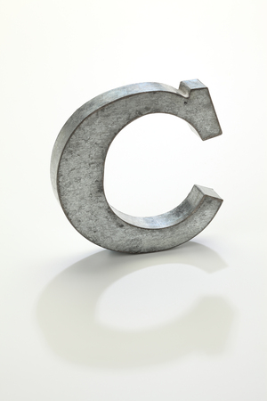 iron letter C isolated on whiteの写真素材