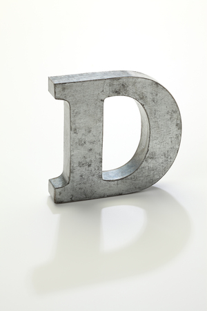 iron letter D isolated on whiteの写真素材