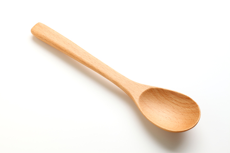 wooden spoon isolated on white backgroundの写真素材