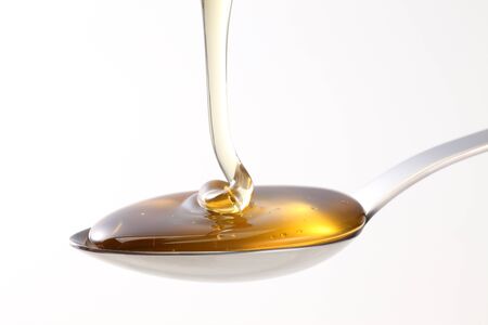 Honey on spoonの写真素材
