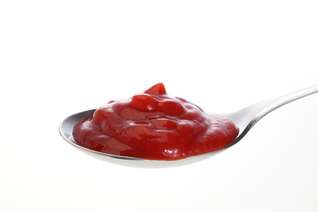 Ketchup on spoonの写真素材