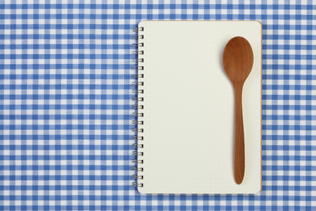 recipe book on checkered tableclothの写真素材