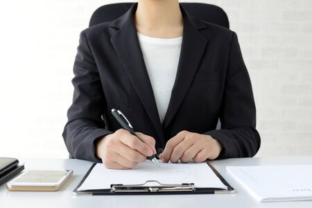 a businesswoman who signs a contract