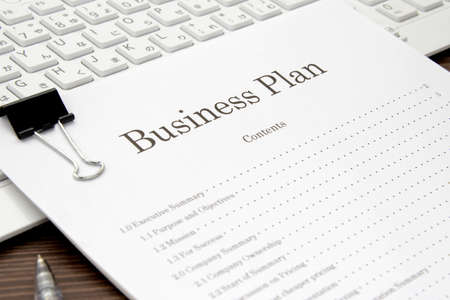 Business plan placed on a computerの写真素材