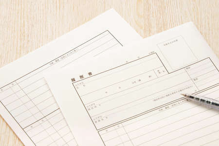 Resume and ballpoint pen