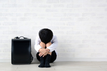 a child with his face face downの写真素材