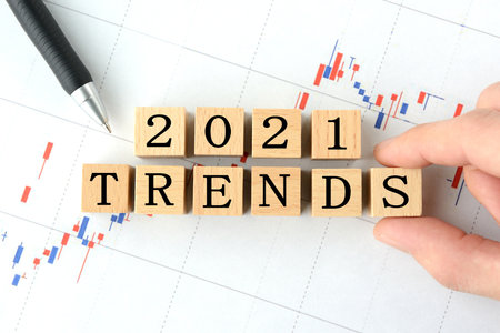 Character blocks and businessman hands representing stock price trends in 2021の写真素材