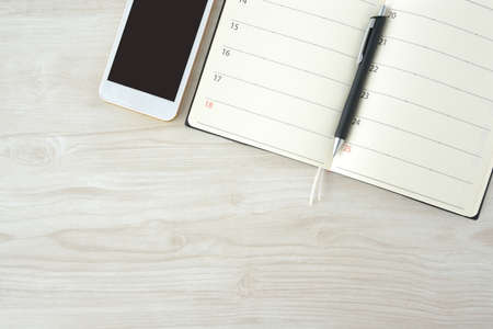 Business handbooks and smartphonesの写真素材