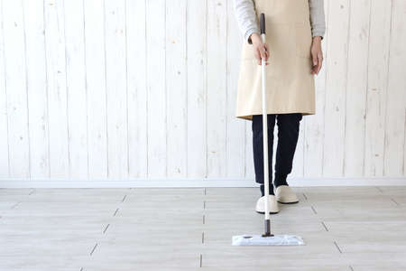 Housewife wiping and cleaning the floor