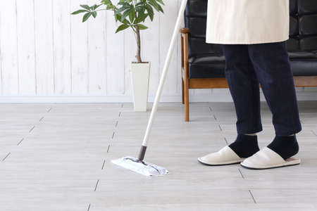 Housewife wiping and cleaning the floor