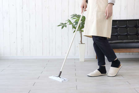 Housewife wiping and cleaning the floor