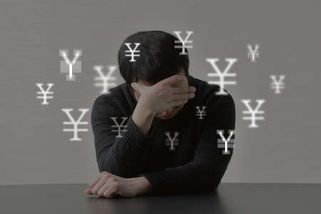 Image of a man with money troublesの写真素材