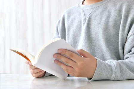 A child reading in the living roomの写真素材