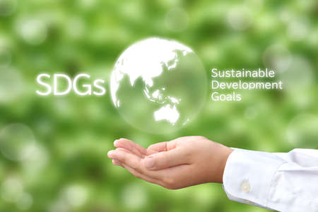 Eco-SDGs Image - Children's Hands Surrounding the Earthの写真素材