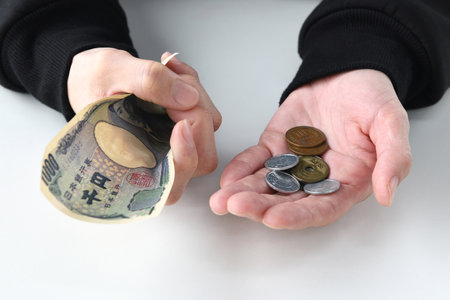 In the hands of a man with money worriesの写真素材