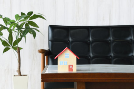 Model of a house on a table in the living roomの写真素材