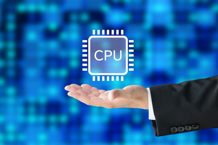 Businessman's hand holding up a semiconductor iconの写真素材