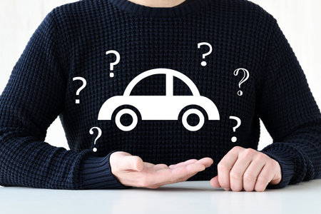 Image of a man having questions about carsの写真素材