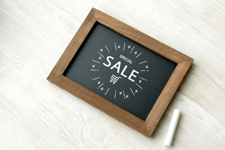 A small blackboard with a special sale banner drawn in chalkの写真素材