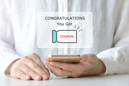 Image of a coupon being sent to your smartphoneの写真素材