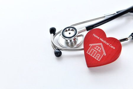 Home medical care image - heart object with house icon and stethoscopeの写真素材
