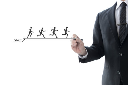 Leadership image in the business field - A businessman showing the way to younger peopleの写真素材